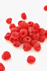 Raspberries on the white background