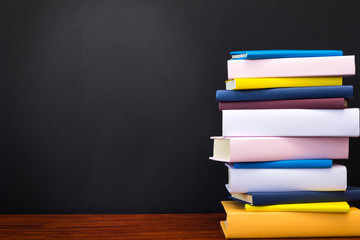 Stack of books on black background