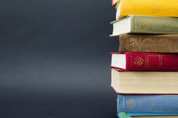 Stack of books on black background