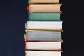 Stack of books on black background