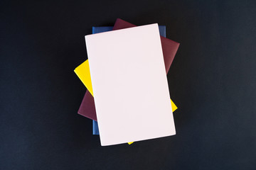 Stack of books on black background