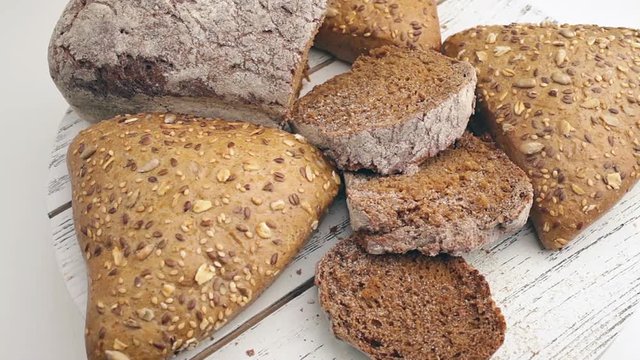 Bread in the rotating basket on a table.