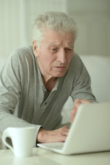 senior man with laptop