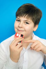 funny teenage boy with a bank card
