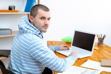 IT programmer working with laptop