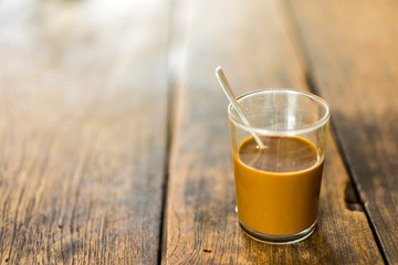 Thai hot coffee on wooden table