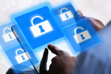 Man working with tablet-pc and icons security on virtual display. Technology, internet and networking concept.