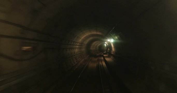 Subway tunnel with all tracks blurred - concept of running away from, hiding, escaping with high speed
