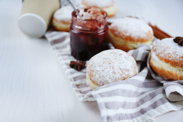Fresh homemade donuts with powdered sugar, close up