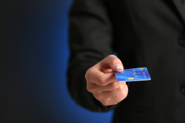 Businesswoman giving a credit card.