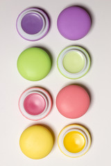  macaroons, lip balms,white background, isolated cosmetic photo