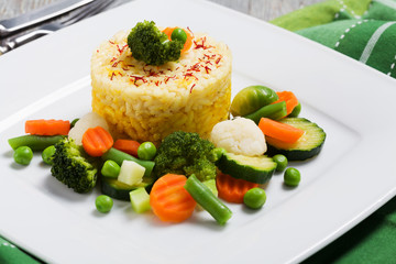 Portion of risotto with vegetables.