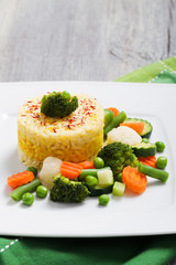 Portion of risotto with vegetables.