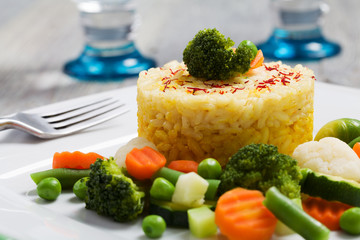 Portion of risotto with vegetables.