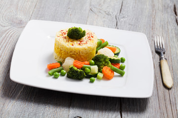 Portion of risotto with vegetables.