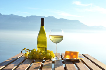Wine and cheese against Geneva lake, Switzerland