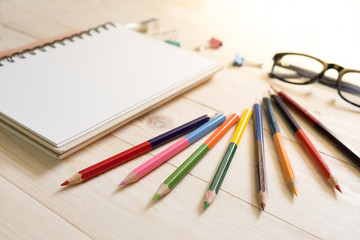 Color Pencil using a sharpener on wodden table