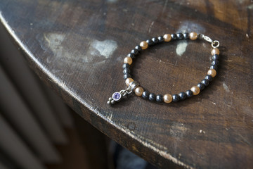 mineral stone yoga bracelet on wooden table