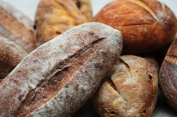 Loaves of Home Baked Leavened Bread made of wheat and buckwheat flour, raisins, tumeric using an antique recipe