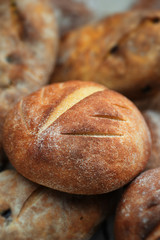 Loaves of Home Baked Leavened Bread made of wheat and buckwheat flour, raisins, tumeric using an antique recipe