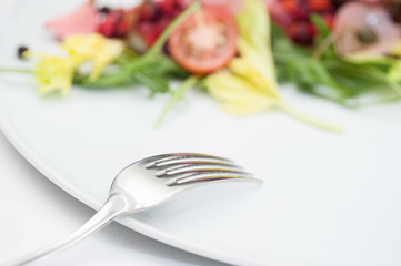 Fork on the background of Russian Vinaigrette Salad