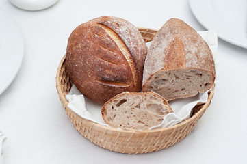 Home Baked Bread in a Basket on a Restaurant Table