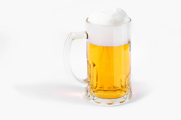 Glass of beer with foam on a white background