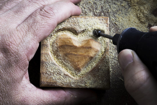 carving wood in heart shape