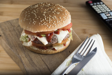 hamburger on cutting board. homemade sandwich with cheese,