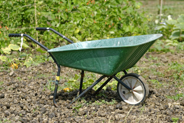 Wheelbarrow in an Allotment Garden where land is made available for personal cultivation of fruit and vegetables.