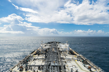 Airview of the oil tanker deck in blue sea.