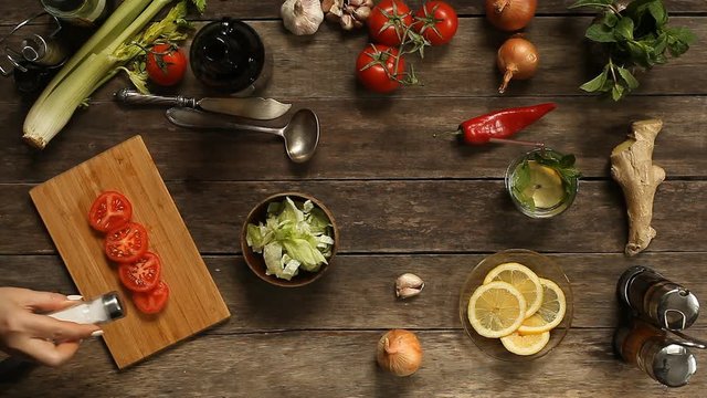 cut tomato salad on a wooden table top view