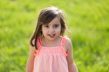 Sweet little girl outdoors playing