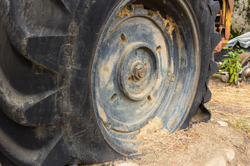 leak tractor wheel, which is old tire