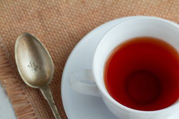 cup of tea with teaspoon