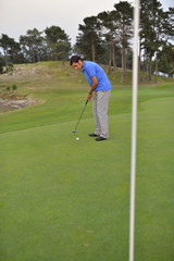 Young man playing golf