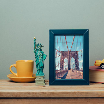 Travel to New York, USA concept with poster mock up template and souvenirs on wooden table