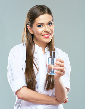 Beautiful woman white shirt dressed hold water glass.