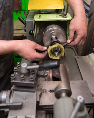 Mechanic repairing electric generator, repair of starter 
