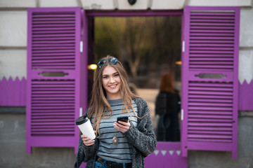 beautiful girl with coffee and tablet