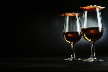 Elegant Spanish tapas on sherry glasses