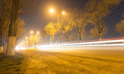 road at night with moving cars