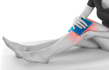 close up of female hands holding knee