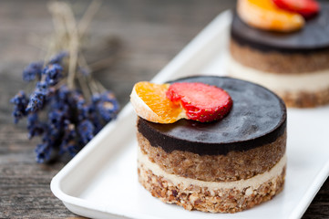 Raw vegan cake with chocolate on top