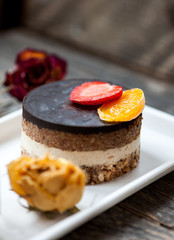 Raw vegan cake with chocolate on top
