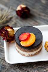 Raw vegan cake with chocolate on top