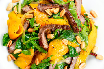 Fresh Tasty Mango, beef salad with vegetables and nuts.