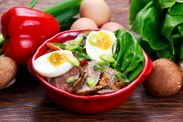 Duck noodles with egg, vegetables and duck meat in bowl