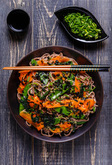 Soba noodles with vegetables and seaweed.