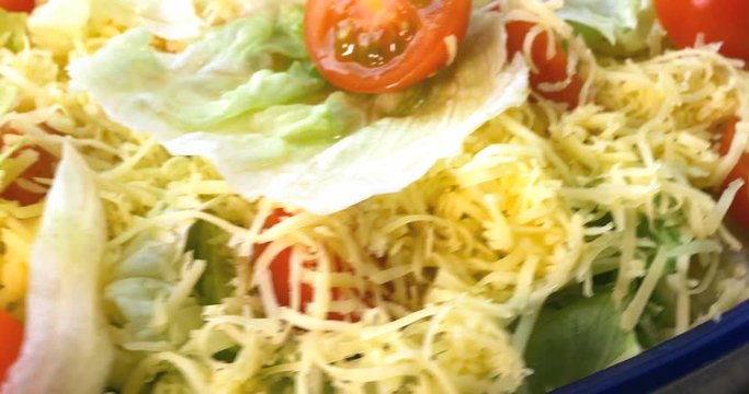 Beautiful colourful caesar salad with dressing croutons and parmesan cheese, healthy meal